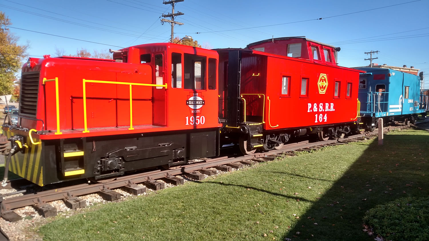 Our current front lineup at the Lake Shore Railway Museum. Our GE 25 tonner, the Pittsburg and Shawmut caboose and our latest addition , a Conrail caboose.